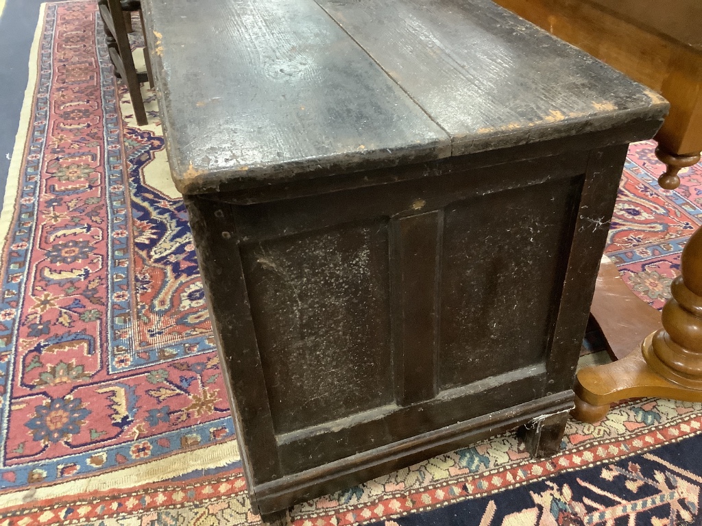 A 17th century oak coffer, length 142cm, depth 53cm, height 64cm